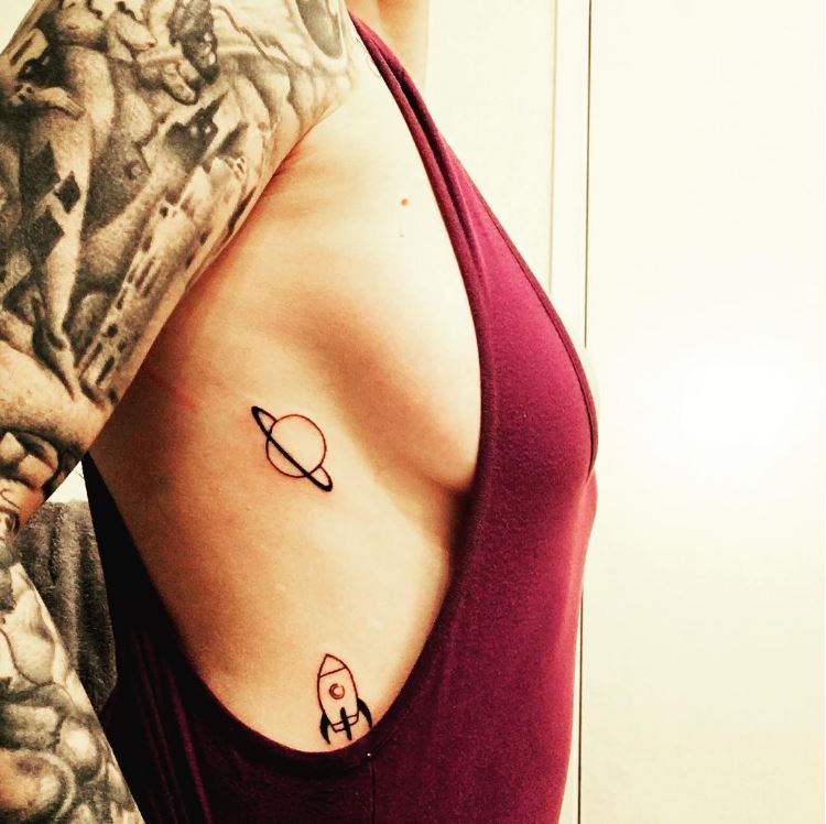  One braless woman flaunts her space inking