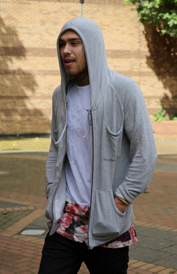  Marco covered up in a grey hoodie as he made his way into the court