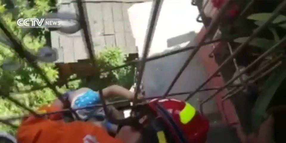  Emergency services had to remove a bar from the balcony in order to pull the tot up