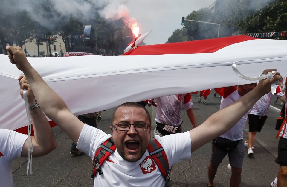 A Polish fan roars as he makes his way to the ground