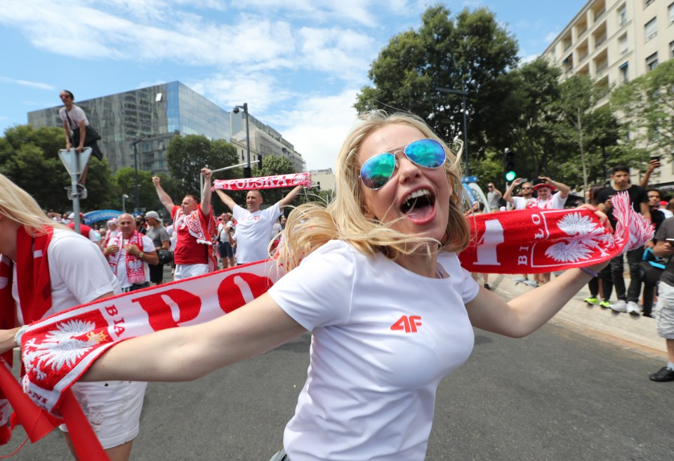 A Polish fan cheers for her team outside the Stade Velodrome