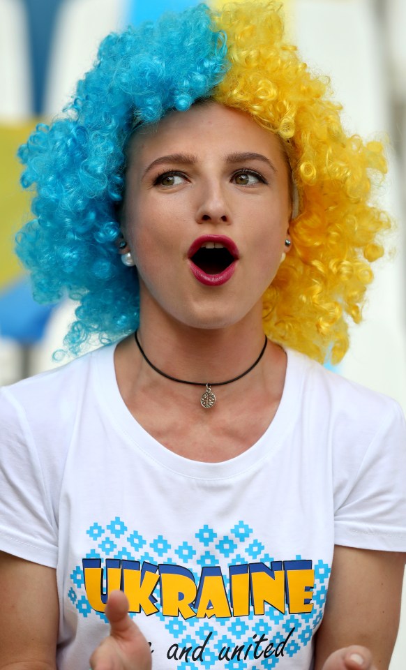 A Ukraine supporter cheers on her team before the defeat