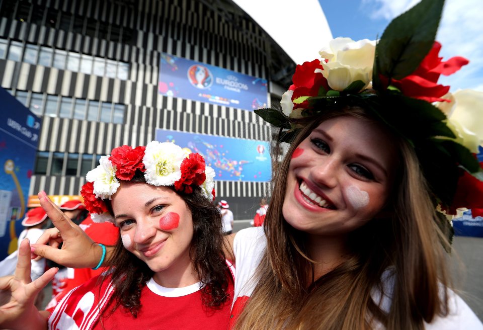 Two more Poland supporters get in the mood before kick-off in Marseilles