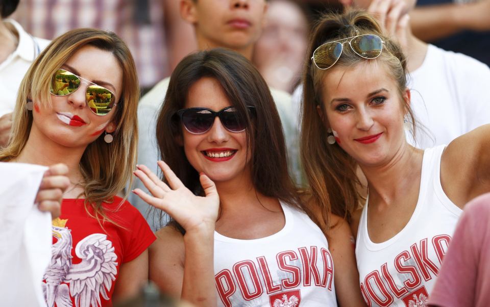 A trio of Poland fans get behind their team at Euro 2016