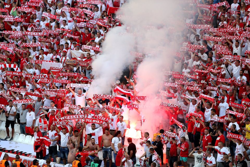 Poland flans let off a flare inside the Stade Veodrome 