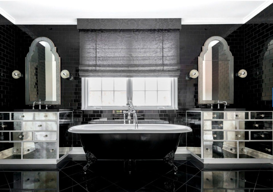  A monochrome bathroom with a clawfoot bathtub