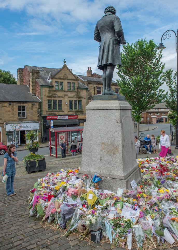  The Joseph Priestly Memorial in the centre of Birstall has become a place where people come and place flowers and take a few minutes to reflect Jo Cox's life