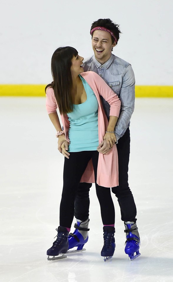 The couple share a laugh together as they manage to remain upright on the ice 