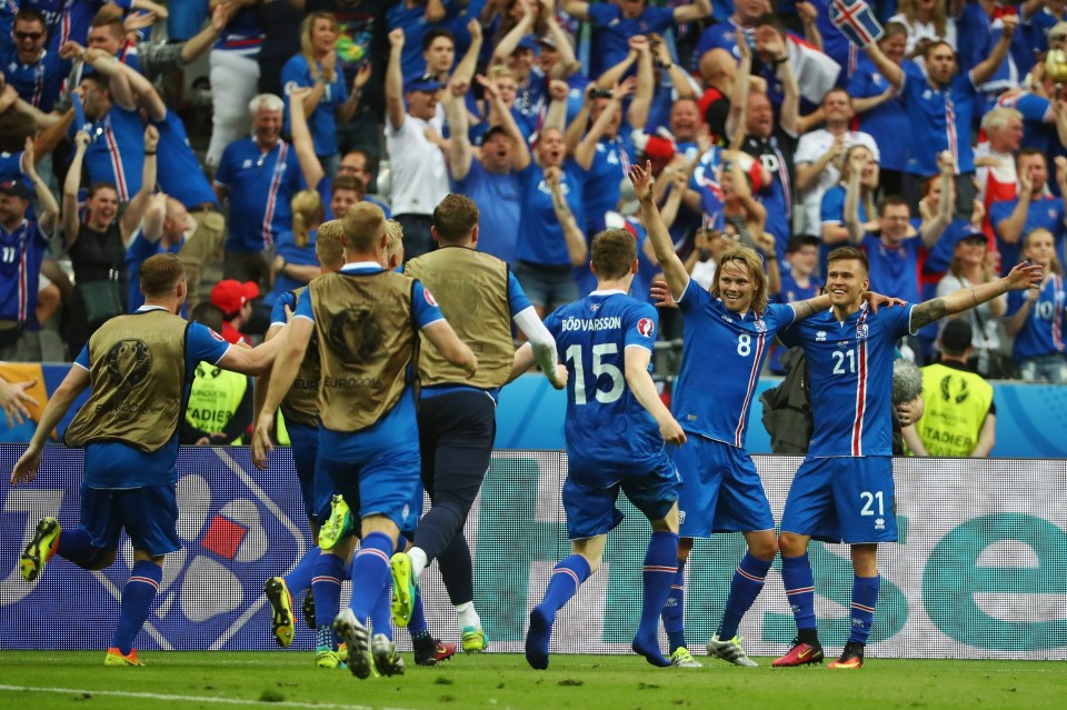  Iceland players celebrate their dramatic late winner against Austria