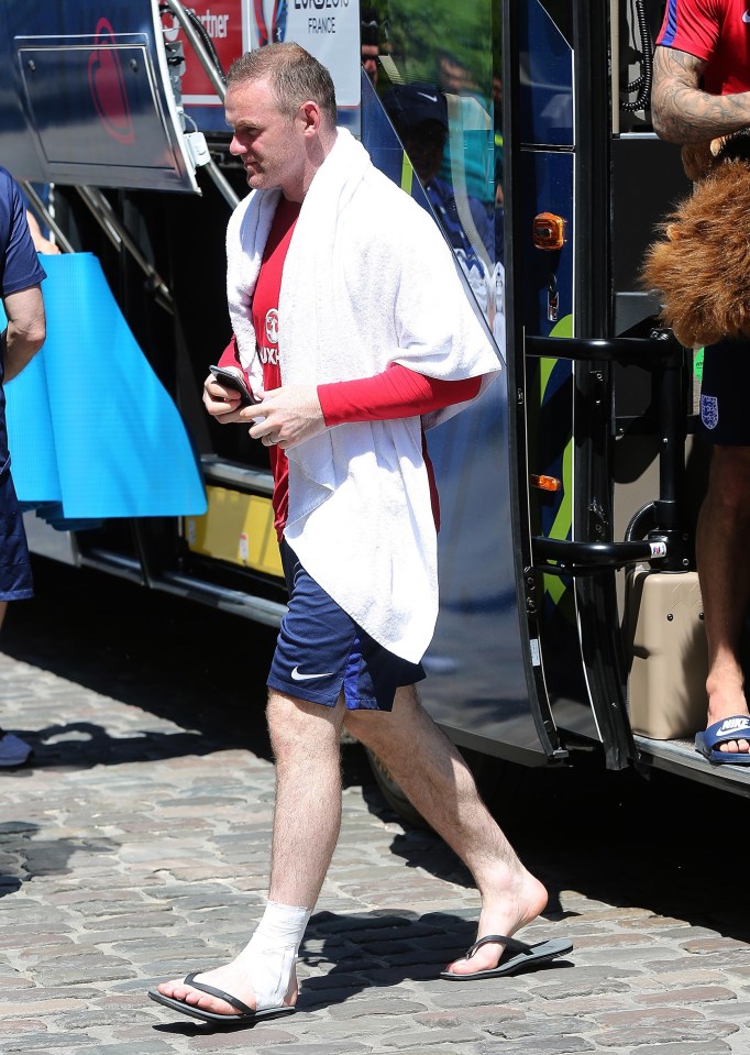 Wayne Rooney leaves for training this morning with his left ankle strapped up as England prepare to face Iceland in the last 16 at Euro 2016