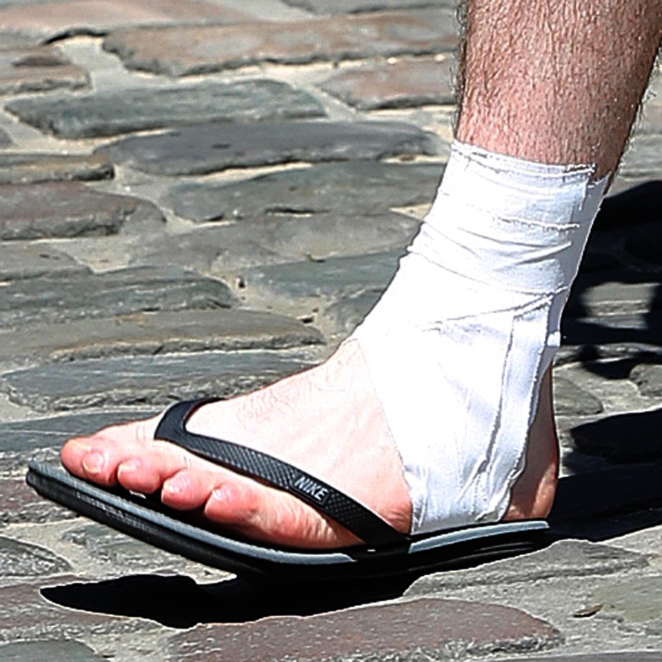  Wayne Rooney shows signs he is carrying an injury with strapping on his ankle