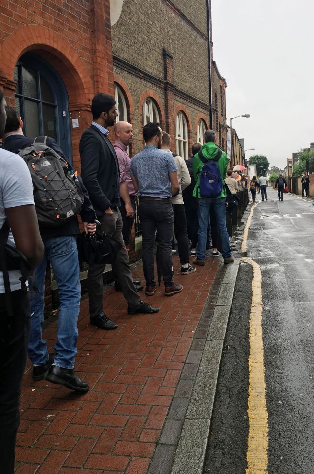  Voters in Battersea wait in a lengthy queue at polling station