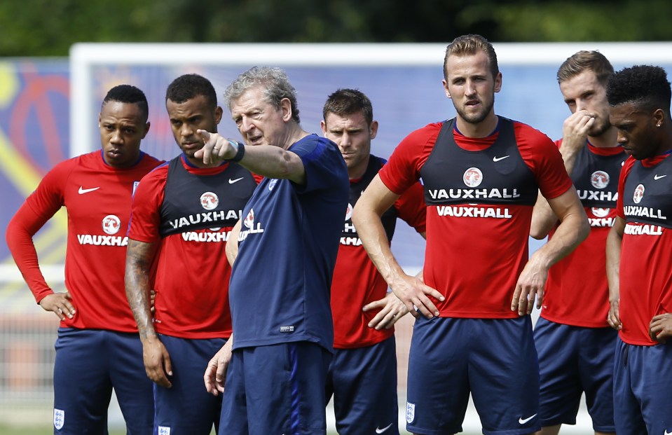  Hodgson attempts to point the way to goal to his players in training