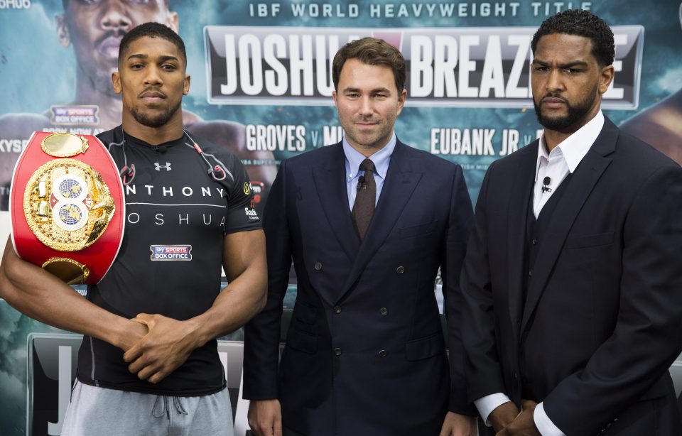  Promoter Eddie Hearn stands between fighters Joshua and Breazeale