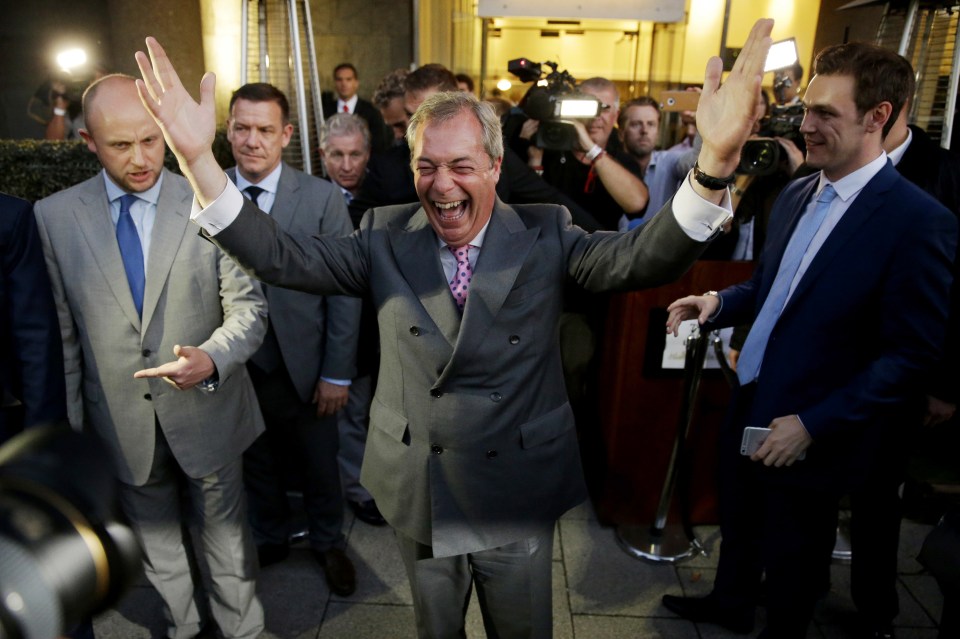  Nigel Farage, the leader of the UK Independence Party celebrates and poses for photographers as he leaves a "Leave.EU" organisation party