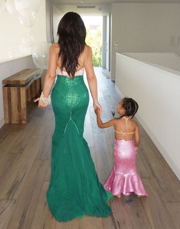  She wrote: “How cute is this mermaid costume North had on?! I had to bring out my 2012 Halloween costume, when I was a mermaid. North was in awe, and I knew I would get major ‘cool mom’ points for wearing this.”