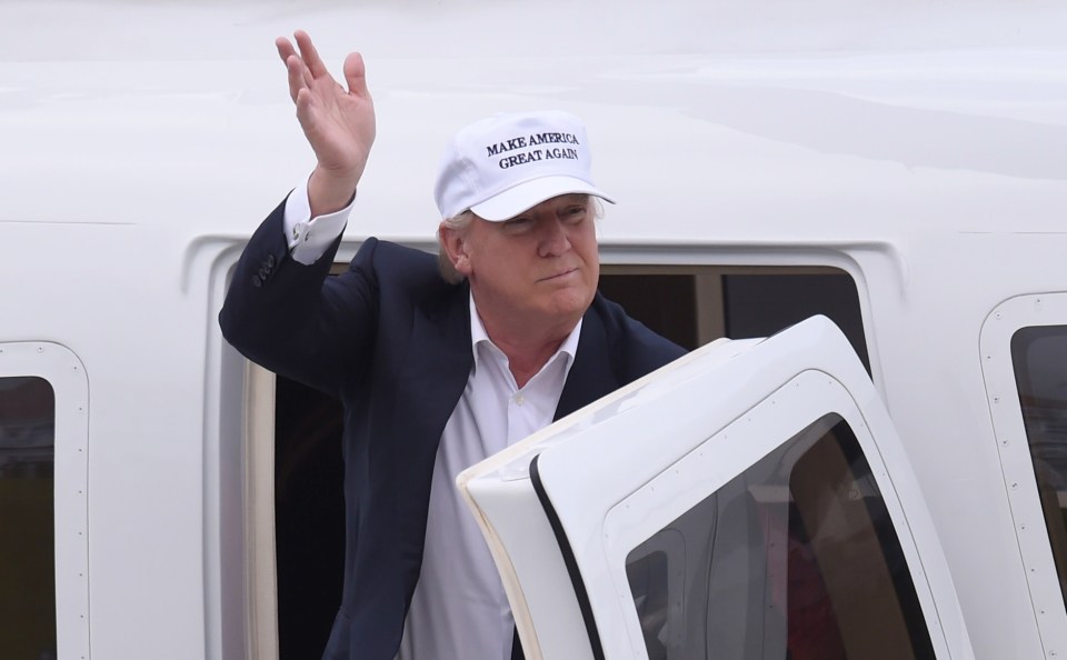  Republican presidential candidate Donald Trump waves as he arrives at his Turnberry golf course, in Scotland