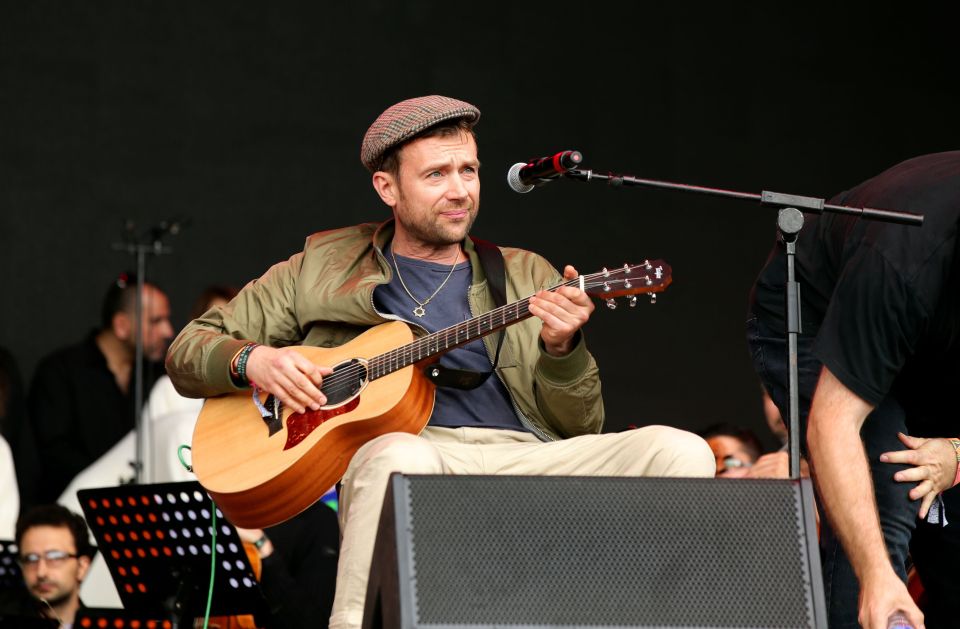  Today's opening act was Blur's Damon Albarn, who performed with the Orchestra of Syrian Musicians