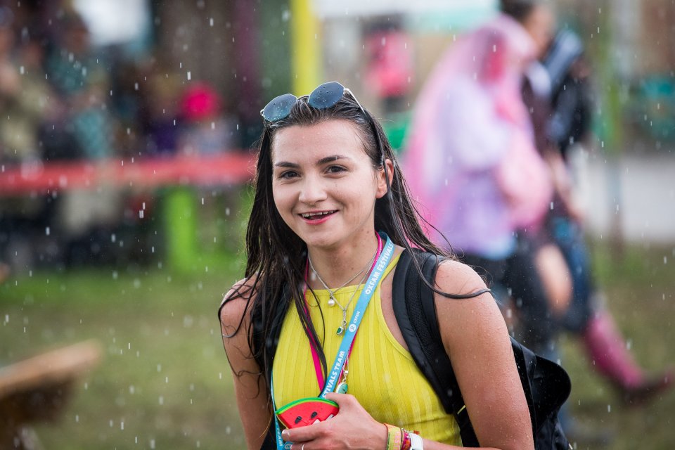 People run for cover during heavy rain in the Hospitality area at Glastonbury Festival, Pilton, Somerset. 24 June 2016. The Glastonbury Festival is a five-day festival of contemporary performing arts that takes place near Pilton, Somerset. In addition to contemporary music, the festival hosts dance, comedy, theatre, circus, cabaret, and other arts