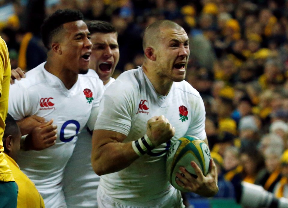  Mike Brown celebrates after scoring a try to put England back into the lead before half-time