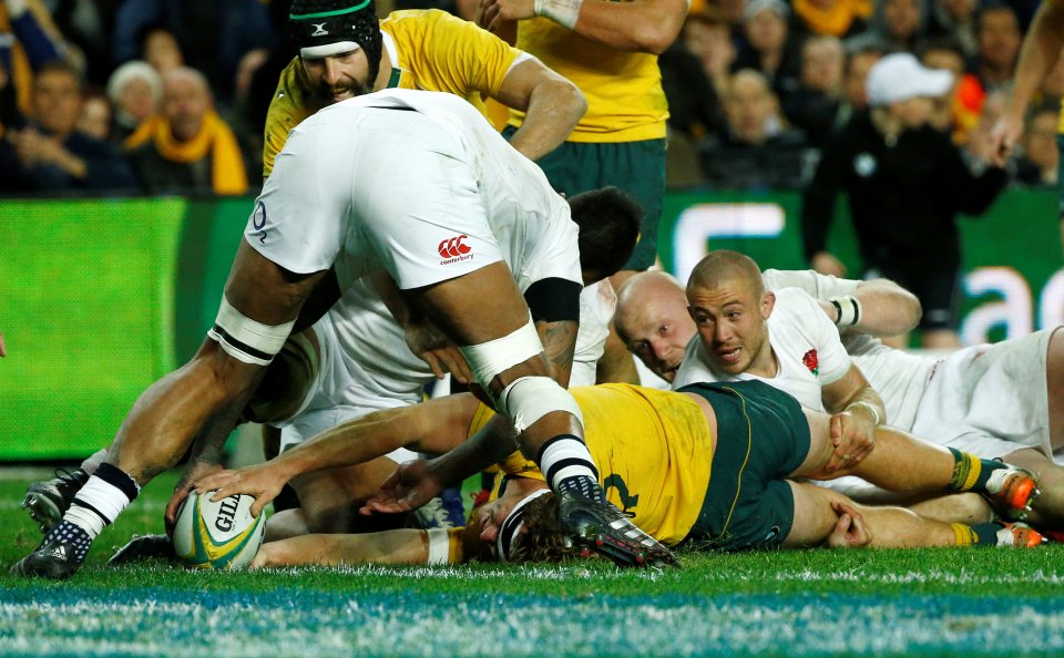  Australia captain Michael Hooper stretches to score for Australia