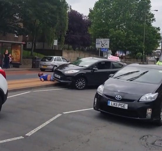  The cabbie goes under the vehicle as the other driver goes over the central reservation in shocking attack