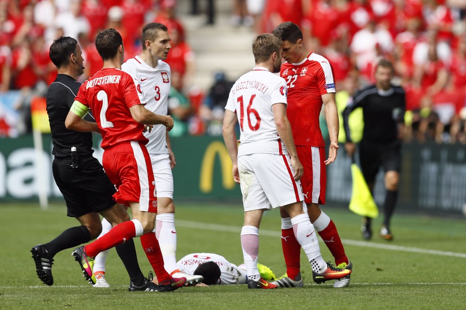  Blaszczykowski and Schar exchange words after the tackle