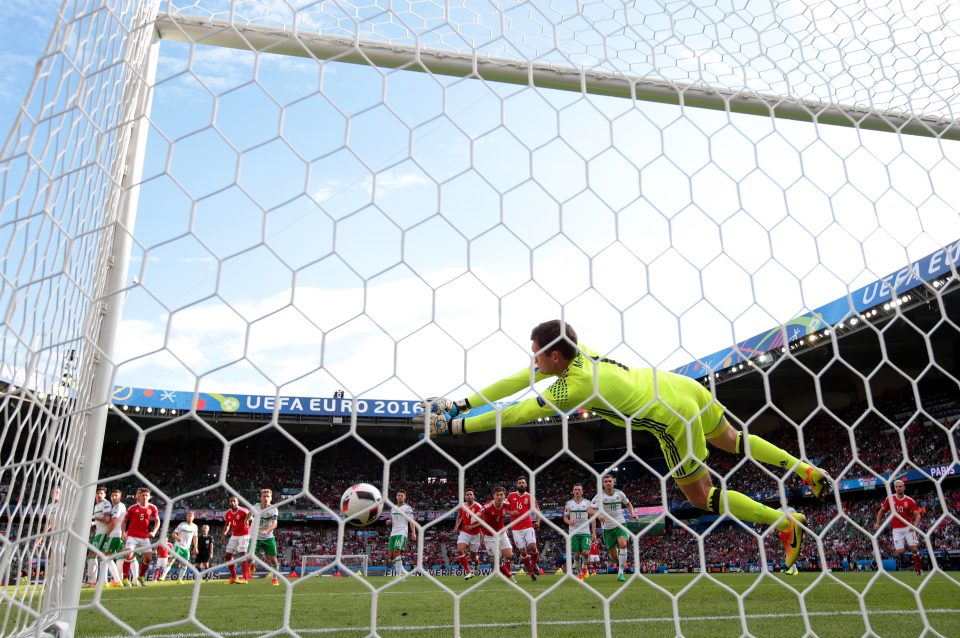  McGovern scrambles across to his left to deny Bales long-range free-kick