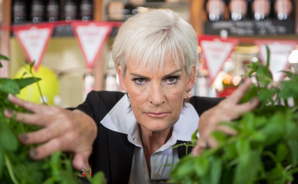  She pushes through swaths of mint, soon to be added to thousands of glasses of Pimm's enjoyed by tennis fans