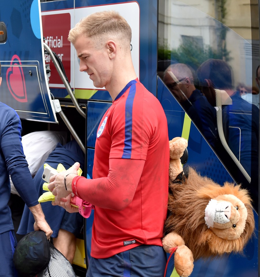  Leo is seen in the not so safe  hands of goalkeeper Joe Hart on Tuesday morning