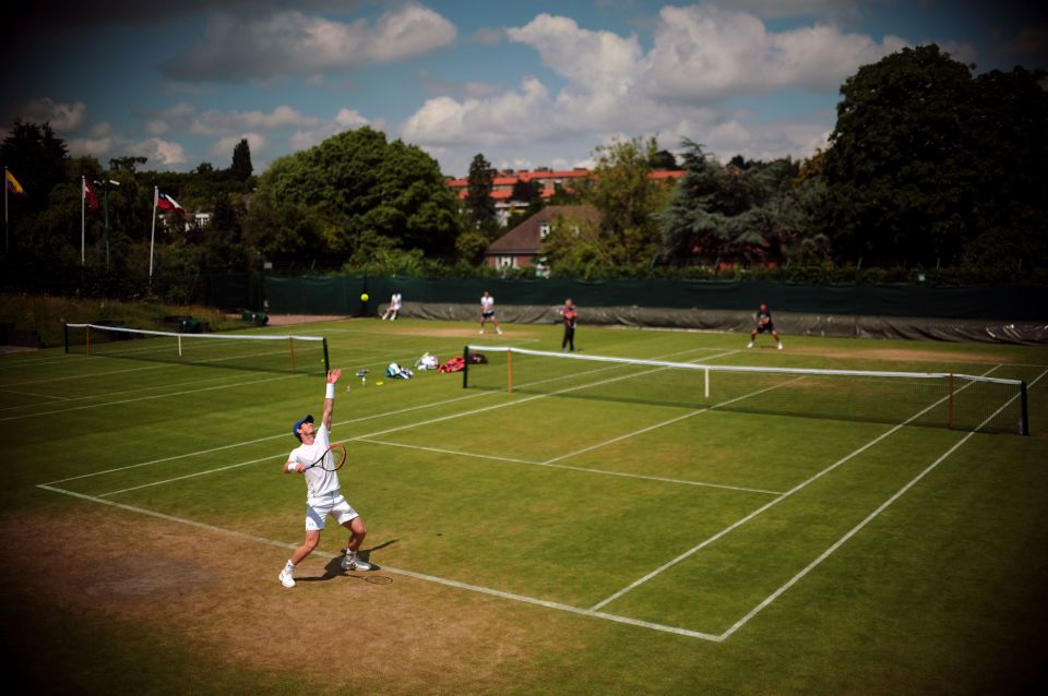  Andy Murray practices his serve before Wimbledon