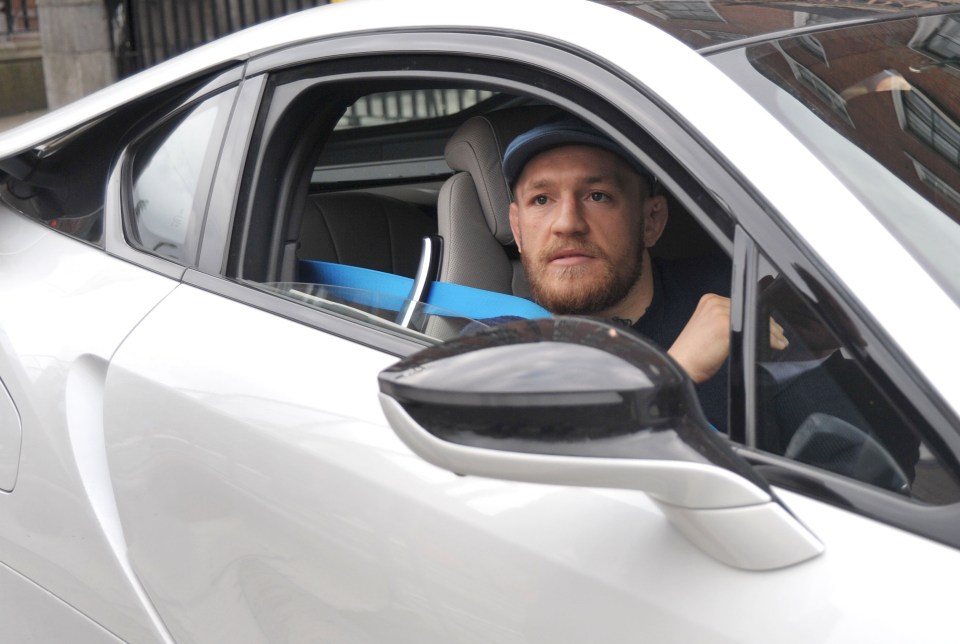 FAMEFLYNET - Exclusive: UFC Fighter Conor McGregor Seen Arriving In His BMW i8 At The Mansion House