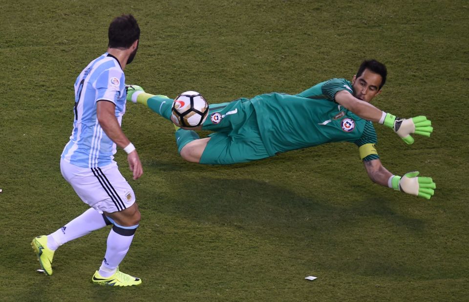 Gonzalo Higuain chips Claudio Bravo but fails to score and give Argentina the lead