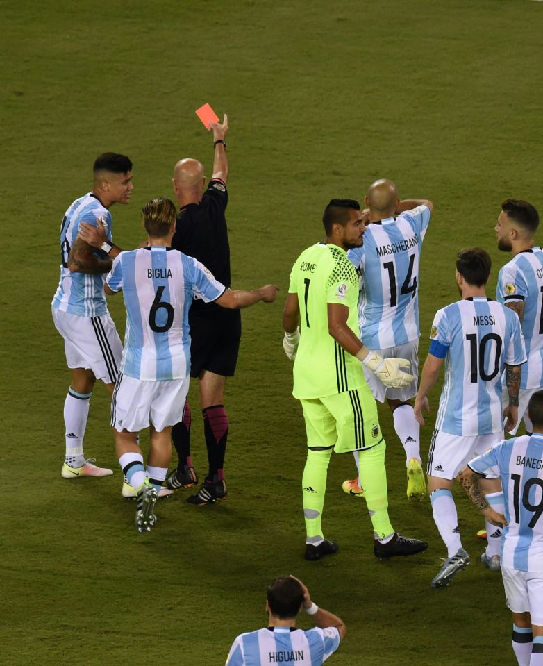 Argentine defender Marcos Rojo is sent off by referee Heber Lopes