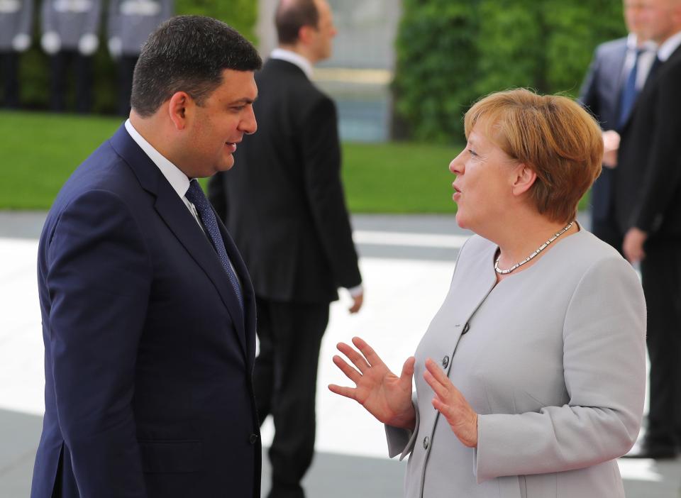  Merkel, pictured with the prime minister of Ukraine, has called for a greater unity and cooperation between Euro zone countries