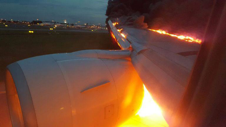 Terror in the skies: A shocking picture taken by a passenger on board the Singapore Airlines flight captures the moment the engine explodes mid-air as it came into land