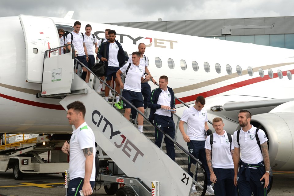  Ireland players depart their plane following defeat to France in the last-16