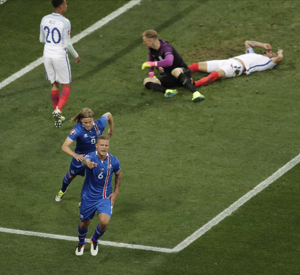 Sigurdsson wheels away in celebration after his goal cancelled out Wayne Rooney's penalty