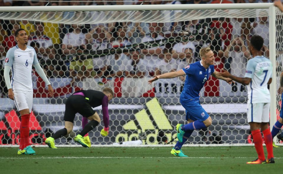 Joe Hart looks back in anguish as Kolbeinn Sigthorsson's shot trickles into the bottom corner as Iceland take the lead against England