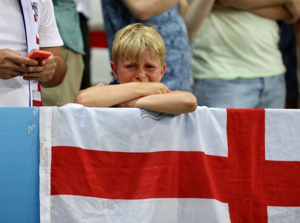  We know the feeling ... young fan gets an early taste of life as an England supporter