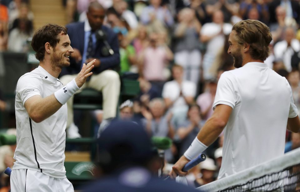  Andy Murray celebrates as he shakes hands with Liam Broady