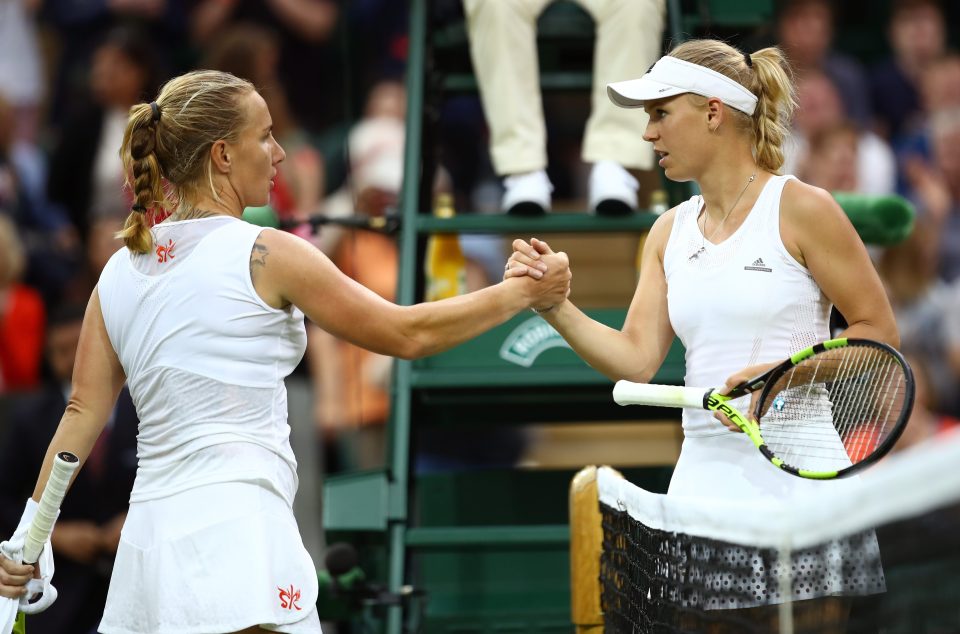  All done... Svetlana Kuznetsova shakes hands with Caroline Wozniacki