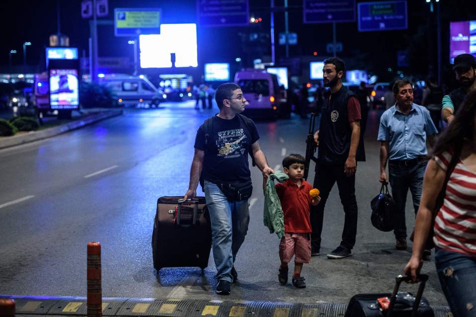  Passengers flee the Ataturk airport following the terror attack which has killed at least 31 people