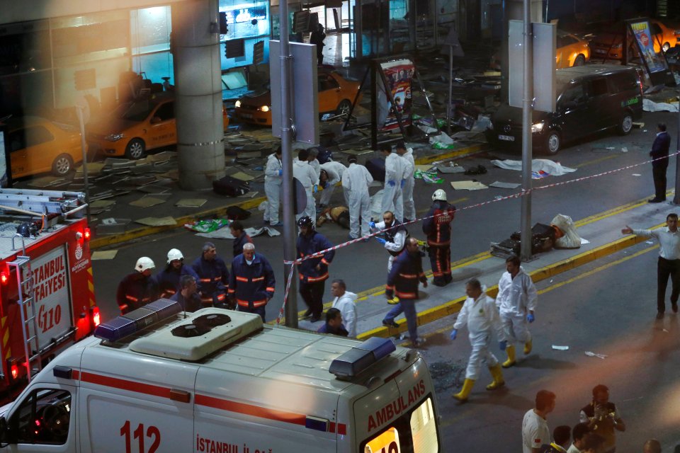  Forensic teams assess the scene of the brutal attack