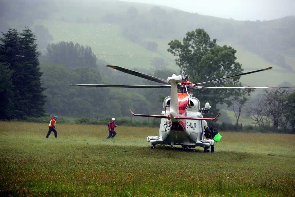  A Coastguard helicopter lands in a field to rescue the children who went missing this afternoon