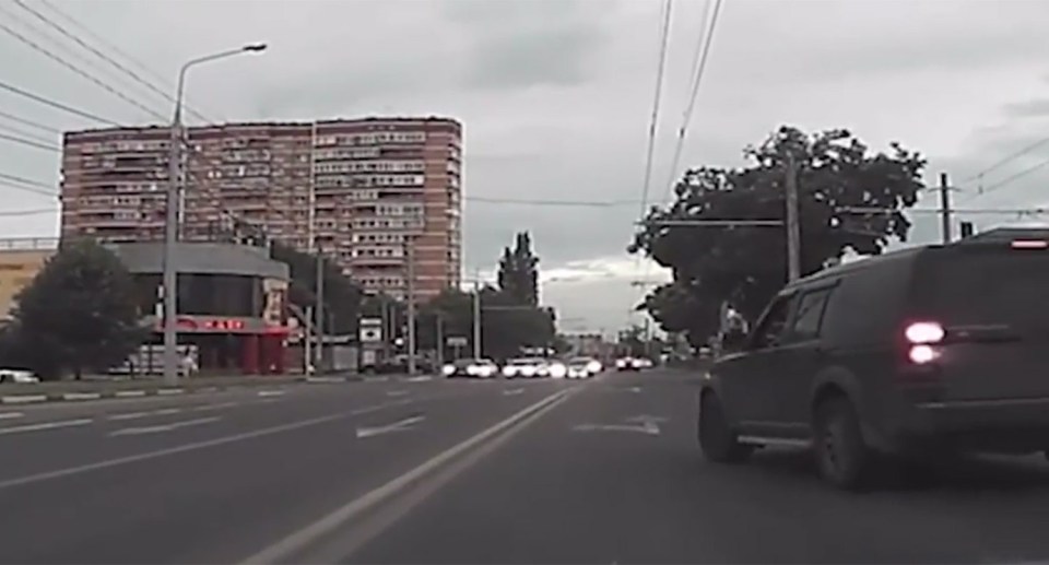  He cuts across two lanes of traffic to block the learner driver