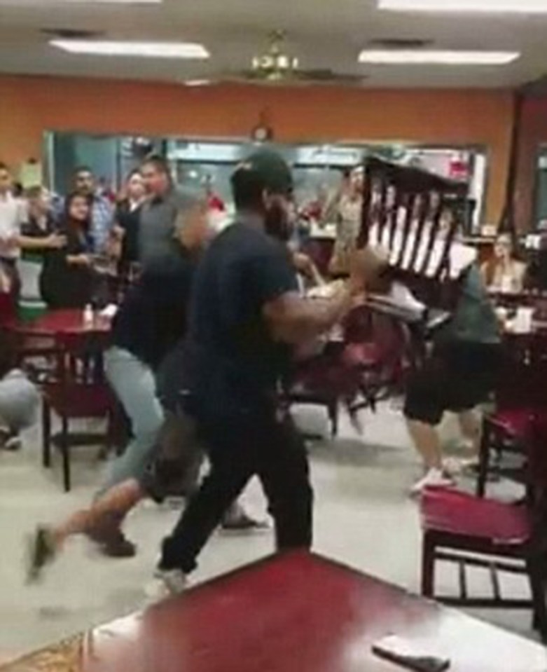  Men throw chairs as the fight heats up