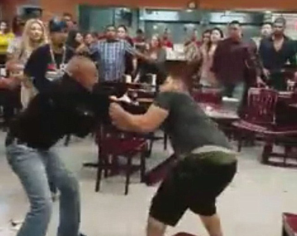  According to the person who filmed the scene, the fight started because they could not decide whether to order the red or green salsa