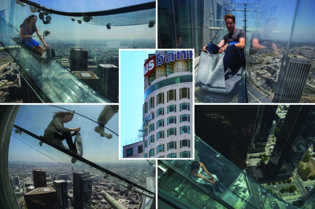 Terrifying see-through Skyslide perched nearly 1,000ft above the city opens in Los Angeles