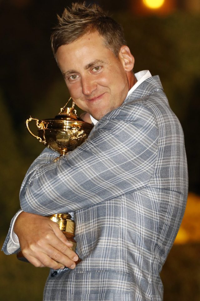  It’s mine, all mine...Poulter with the beloved Ryder Cup he's in danger of missing